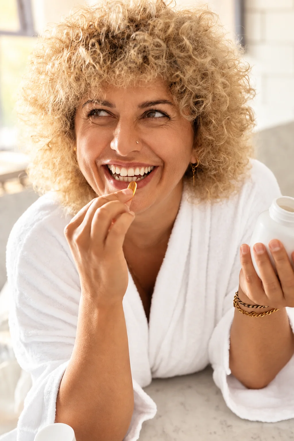 Smiling woman taking a daily supplement at home