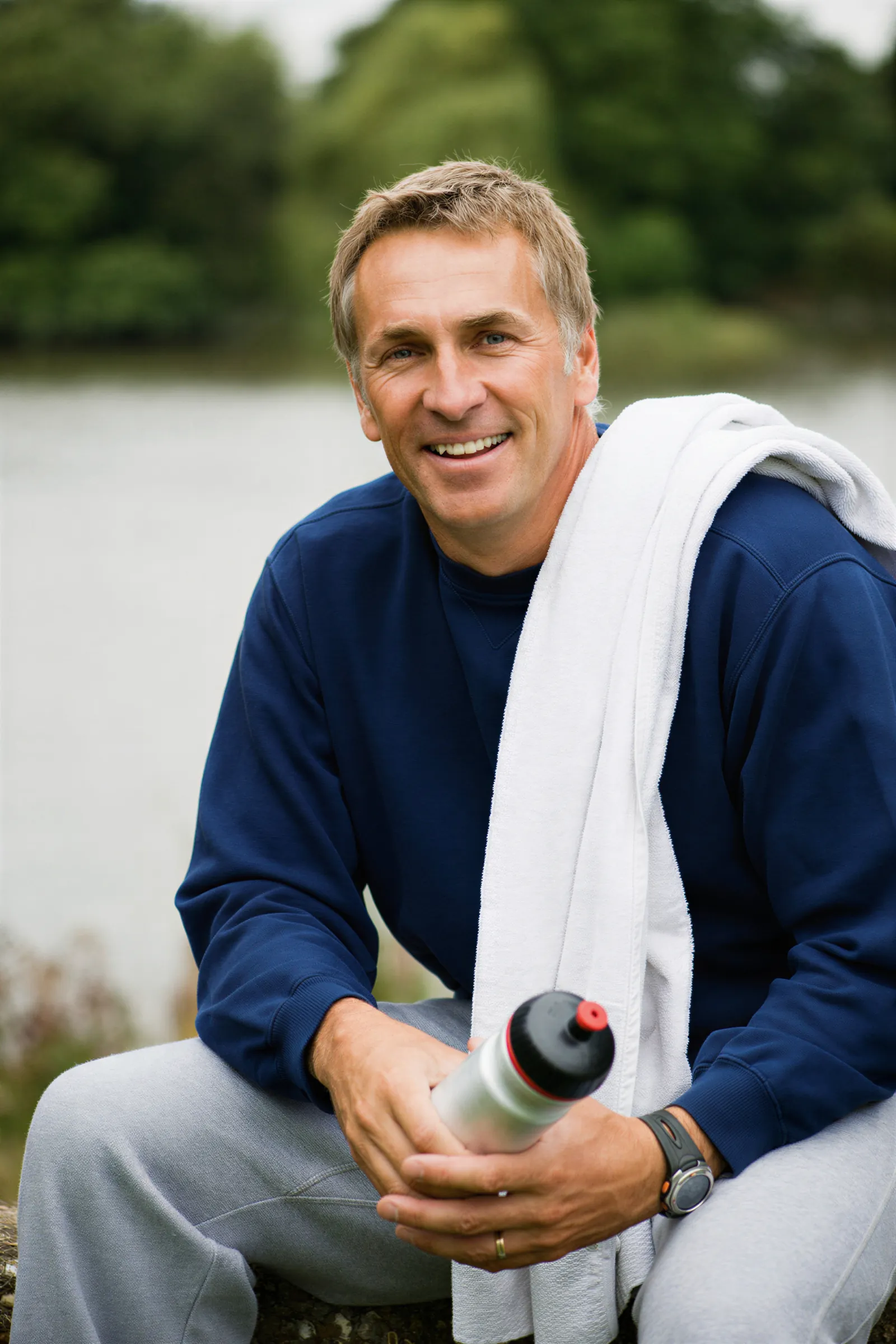 Smiling man relaxing outdoors after a walk